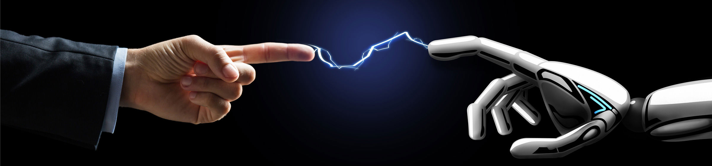 Hånd berører robotarm